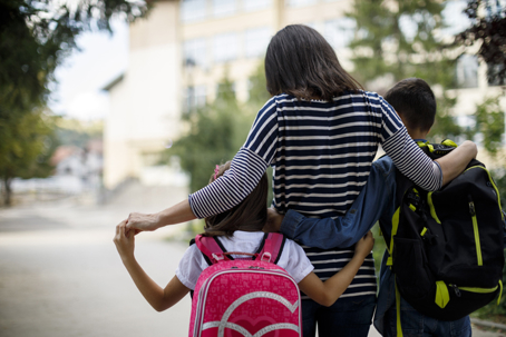 mother seeing children off to school