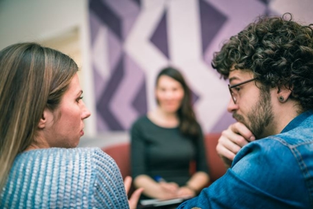 Parents meeting with lawyer to discuss custody modifications