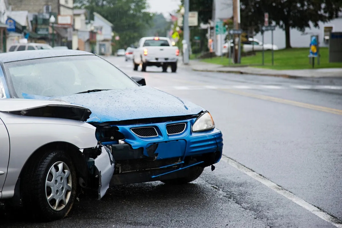 Two damaged cars after a collision on a city street