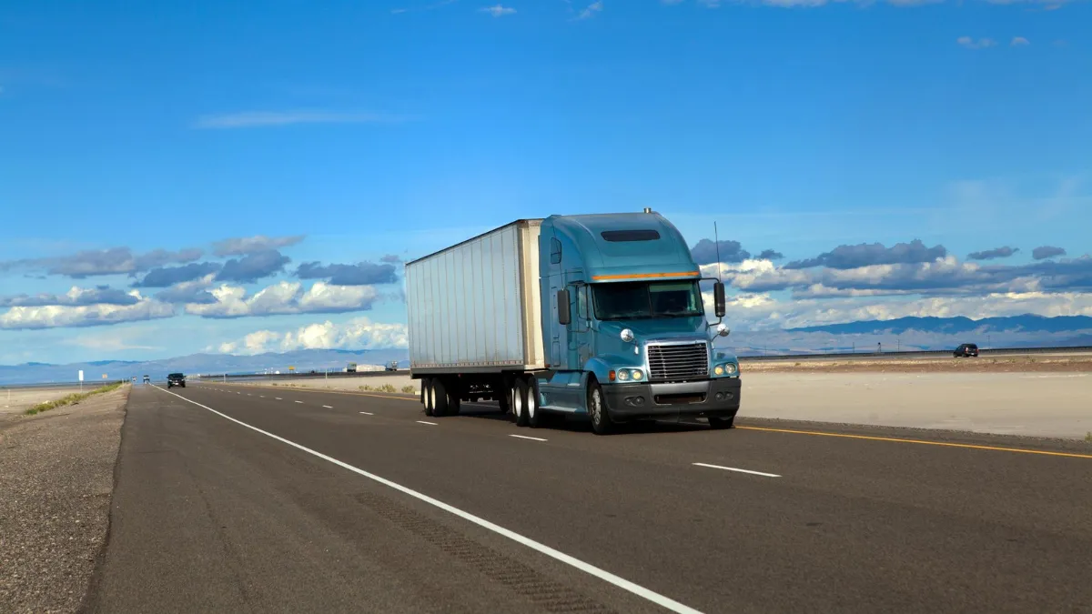 Semi truck driving on an interstate highway